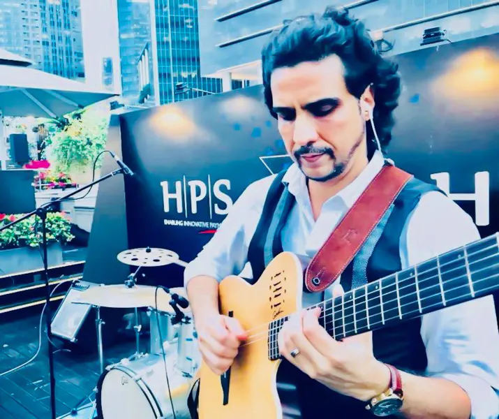 Ernesto Castillo performing at a corporate event