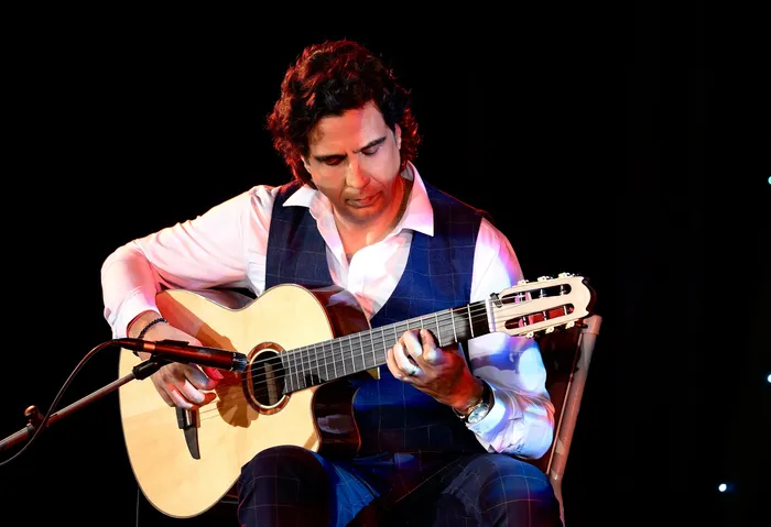 On stage, nylon-string guitar
